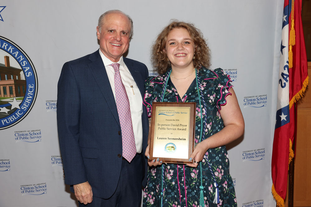 Sen. Mark Pryor presents Lauren Sermersheim with the Founding Dean David Pryor Public Service Award. Photo by Nelson Chenault.
